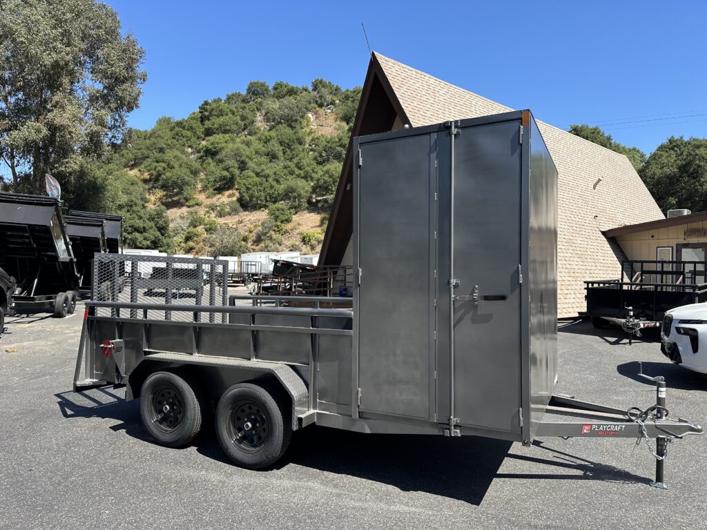 Curbside of custom landscape trailer with 4' x 83" x 6.5' tall enclosed box on the front and 10' of length in the open bed of the trailer
